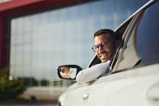 istock Happy businessman going on a trip by car. 2238232539