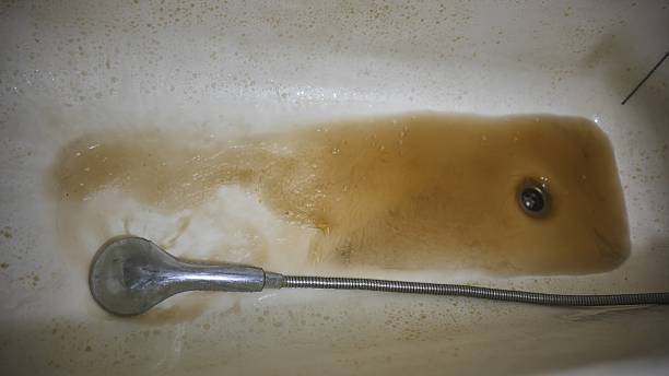 istock Rusty water pours from the bathroom rain gauge. 2238233230