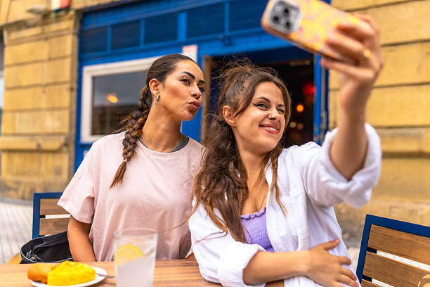 istock Two young women taking a selfie while having breakfast at a cafe 2238233295