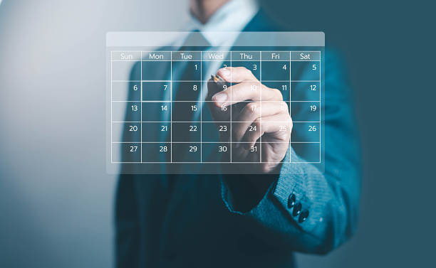 istock Businessman hand writing on virtual calendar interface for scheduling, planning, and time management, representing business productivity, digital technology, corporate organization, and modern 2238236091