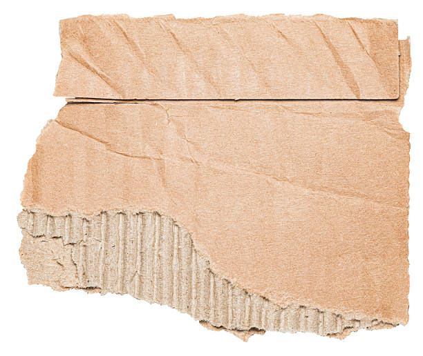 istock Isolated torn piece of brown corrugated cardboard paper with texture and copy space for text on white background 2238242782