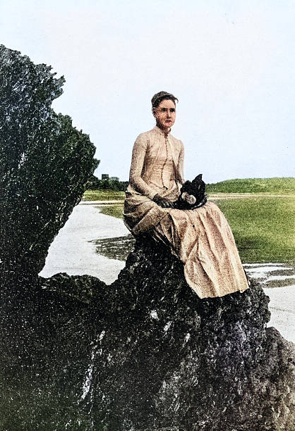Antique Photograph: Woman on rock by the sea, Maine
