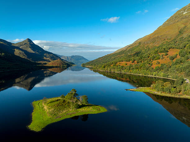 Loch Leven , under a blue sky with mountain reflections, Scotland.