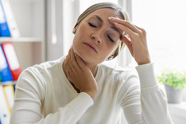 istock Woman holding her head and having pain 2238255896