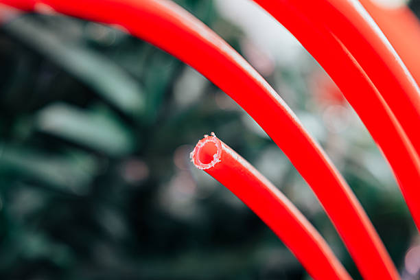 istock Closeup of Red Plastic Pipe with Hollow End 2238257096