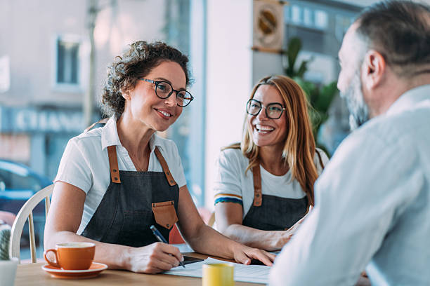 istock Coffee shop owners meeting with financial advisor. 2238258265