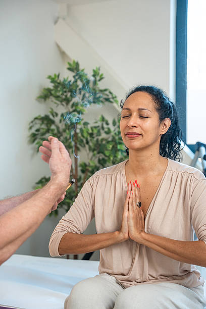 istock Mid-Age Hispanic Woman Practicing Meditation with Palo Santo in a Peaceful Indoor Setting 2238260254