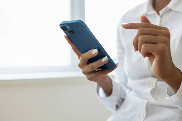 istock Female checking her phone 2238261481