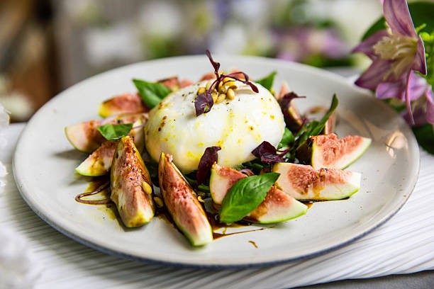 Burrata cheese and fresh figs on a plate