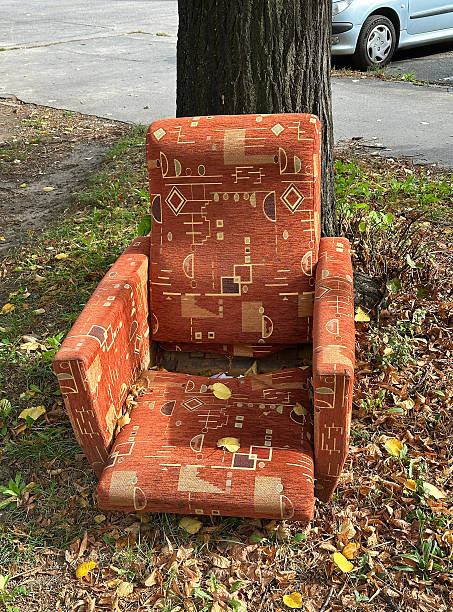 istock Old ruined armchair under a tree outdoor 2238263066