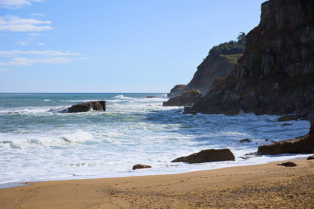 istock Scenic sandy beach with rocky coastline 2238265155