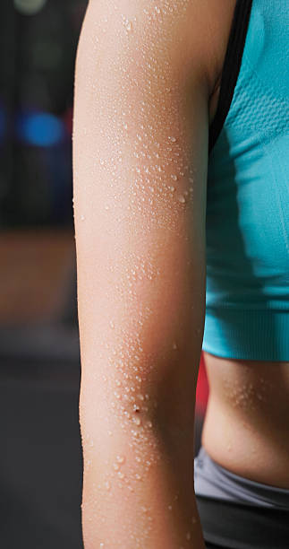 istock asian woman wiping sweat while gym exercise 2238266595