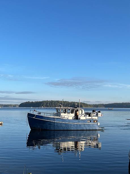 istock a boat on the water and its reflection 2238266655