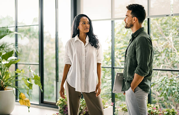 istock Two happy diverse multiethnic business team people working, talking in corporate office 2238268767