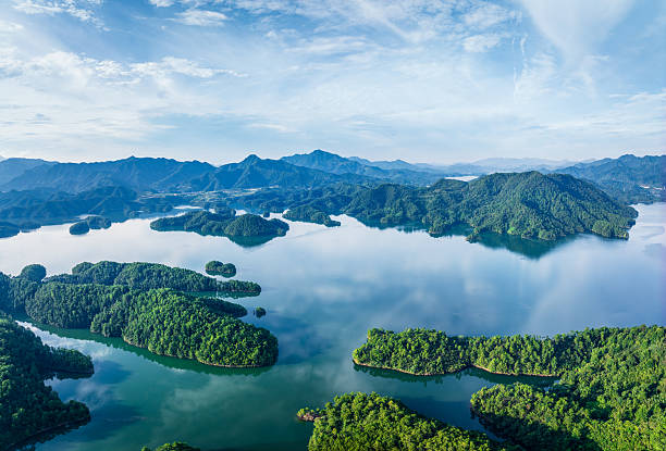 istock Large mountain lake with countless green islands under a blue sky. 2238269116