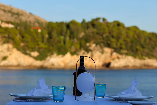 istock Seaside Dining Table with Scenic Coastal View 2238270233