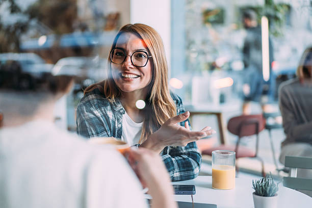 istock Happy women talking in coffee shop. 2238270883