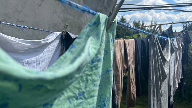istock washed clothes and linens are drying on a line outside 2238271498