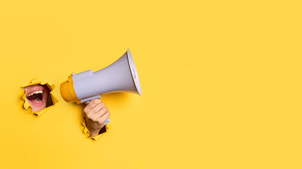 istock Female mouth screaming in megaphone to copy space 2238271543