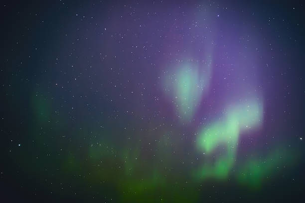 istock Aurora borealis, polar lights with Milky Way stars. 2238279519