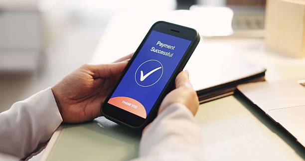 istock Hands, phone screen and ecommerce for payment, transaction or banking in office. Fintech, smartphone and person for online shopping, internet sales and checkmark notification UI for finance app 2238280084