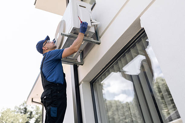 istock Repairman fixing AC outdoor unit. 2238280389