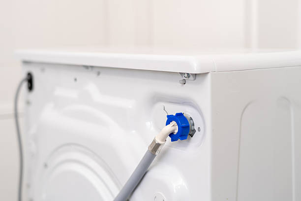 istock Selective focus on rubber pipe connected to the back of a washing machine 2238280406