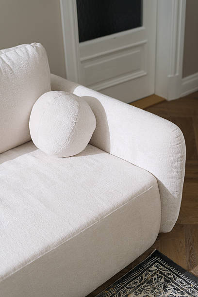 istock Minimalist couch design for a serene living room atmosphere 2238280436