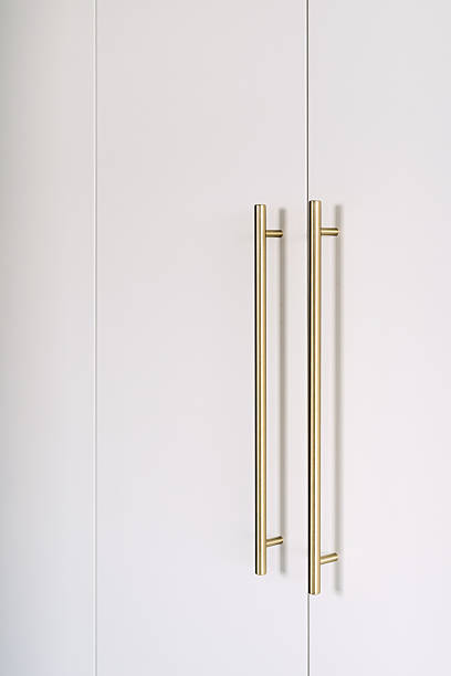 istock Minimalist wardrobe design features elegant gold door handles for modern interiors 2238280441
