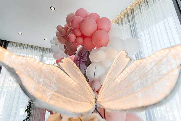 Luxury chair with Pink balloons floating on pink background 3d rendering. 3d illustration minimal party style concept.