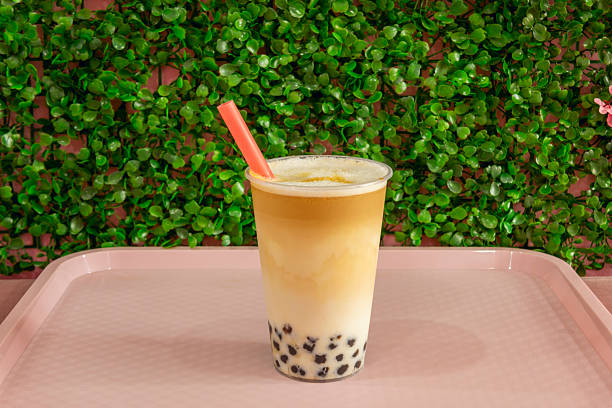 istock Sweet Peach Iced Tea: Vibrant blend of black tea with peach juice, garnished with fruit segments and mint for a refreshing touch 2238282630