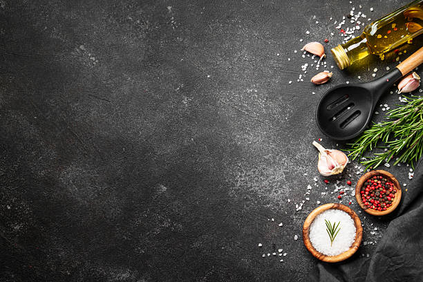 istock Spices and herbs at black top view. 2238282968