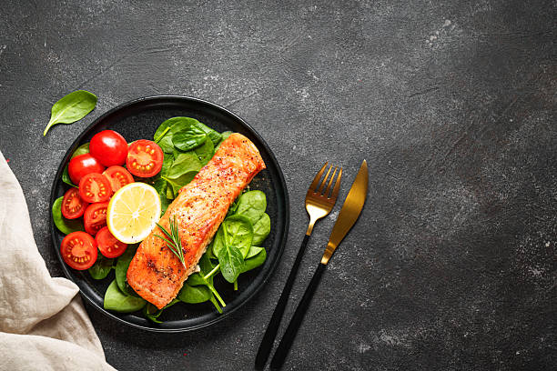 istock Grilled salmon fillet with fresh salad. 2238284768