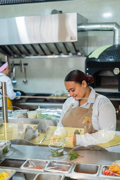 istock Restaurant owner gets ready to open the doors and start serving customers 2238287593