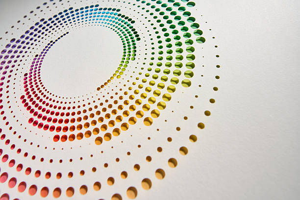 istock Spiral Dot Pattern Cut from White Paper Revealing a Vibrant Rainbow Gradient 2238289781