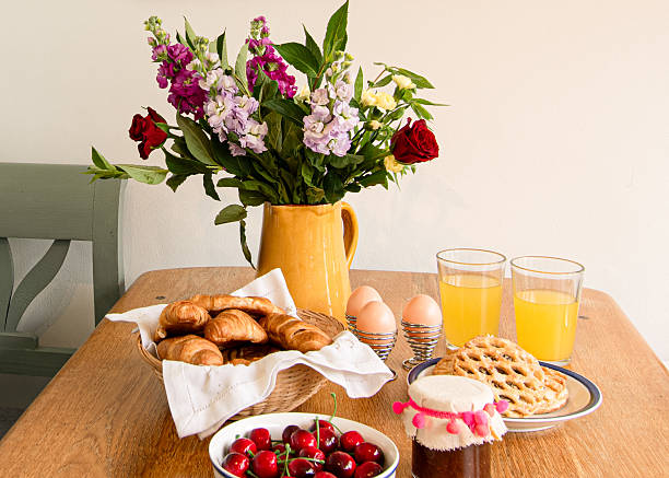perfect  breakfast  with  Paris  laid  out  on table  with  fresh  flowers