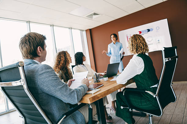 istock Business professionals collaborating in a modern office during a meeting focusing on teamwork and corporate development 2238291921