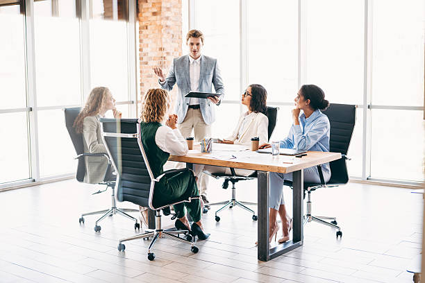 istock Business professionals collaborating during a meeting in a modern office setting, discussing ideas and sharing teamwork strategies 2238292015