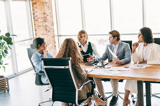 istock Professional coworkers in modern office having collaborative meeting while discussing business strategies and projects 2238292120