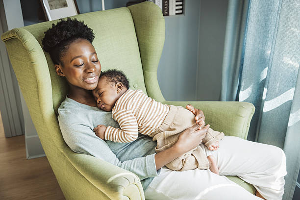 istock Mother holding sleeping baby 2238292164