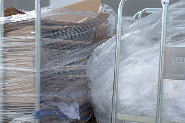 istock A collection of boxes is securely wrapped in plastic and placed on a cart 2238293976