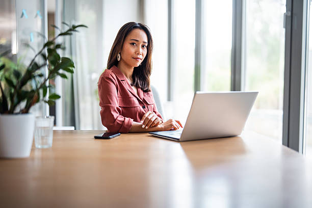 istock Businesswoman Strategizing Projects on Laptop in Modern Office 2238298439