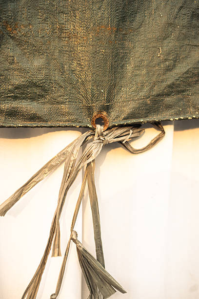istock Tied protective tarp with rusty metal ring 2238303471