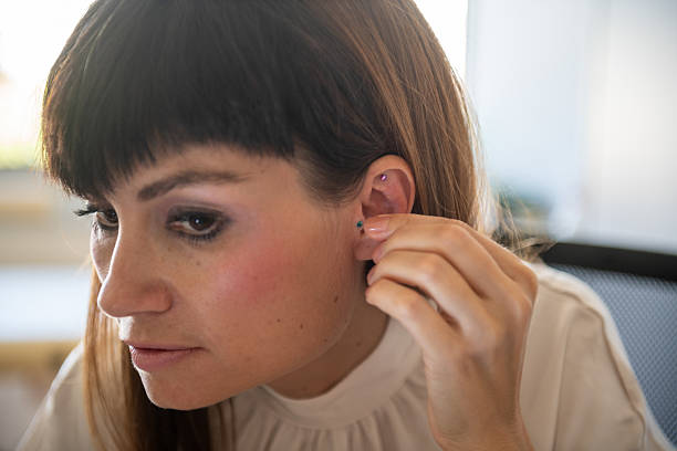 Woman applying Auriculotherapy method -Naturopathic Alternative Medicine.