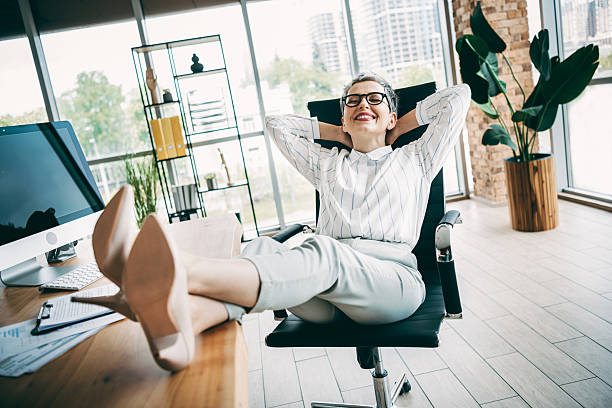 istock Professional businesswoman relaxing in stylish modern office workspace with computer and indoor plants 2238305190