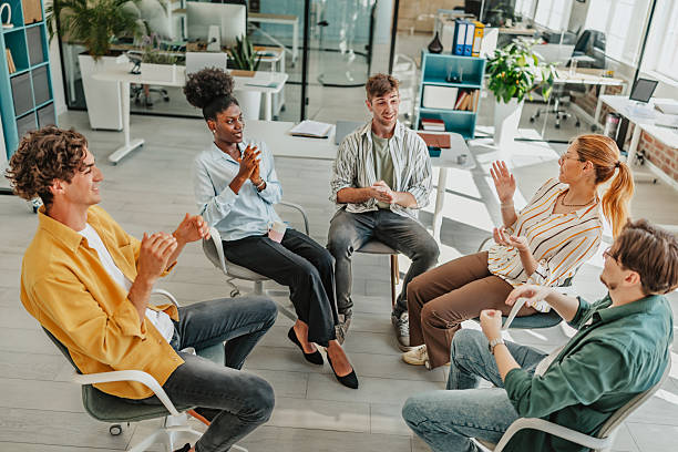 istock Young adults engage in collaborative discussion in a modern office setting focused on teamwork and idea sharing 2238306270