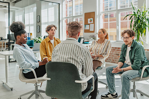 istock Young adults engaged in a productive office meeting focused on teamwork and collaboration 2238306679