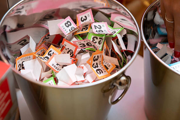 Wine cooler full of raffle tickets ready for selection at a fundraising event