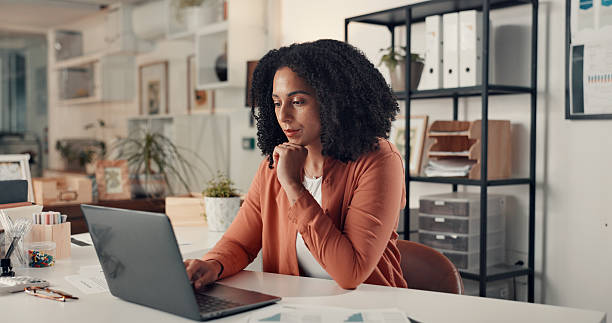 istock Woman, laptop and thinking at startup for project, solution or insight for info at digital agency. Person, computer and perspective in office for decision, report or social media marketing at company 2238308477