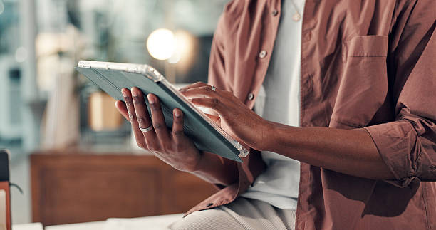 istock Hands, tablet and person with reading in office, scroll for research or info for marketing campaign. Bokeh, review or worker with tech to check online traffic, multimedia project or creative startup 2238308594